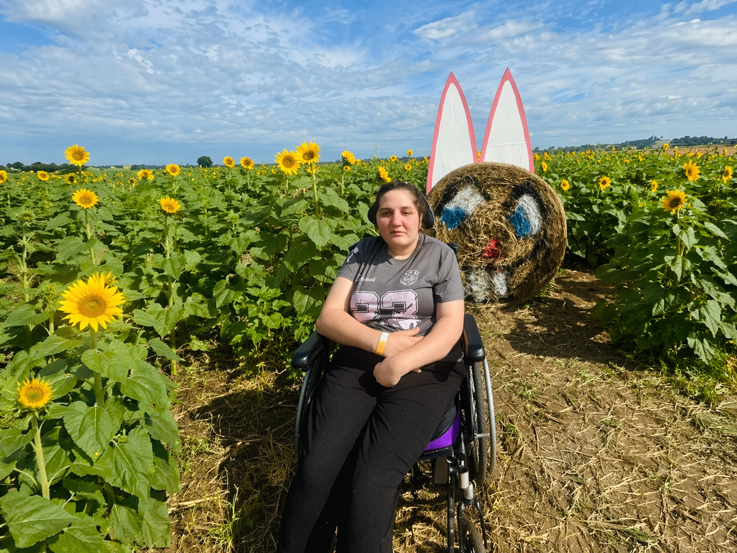 Pure Living participant in sunflower field