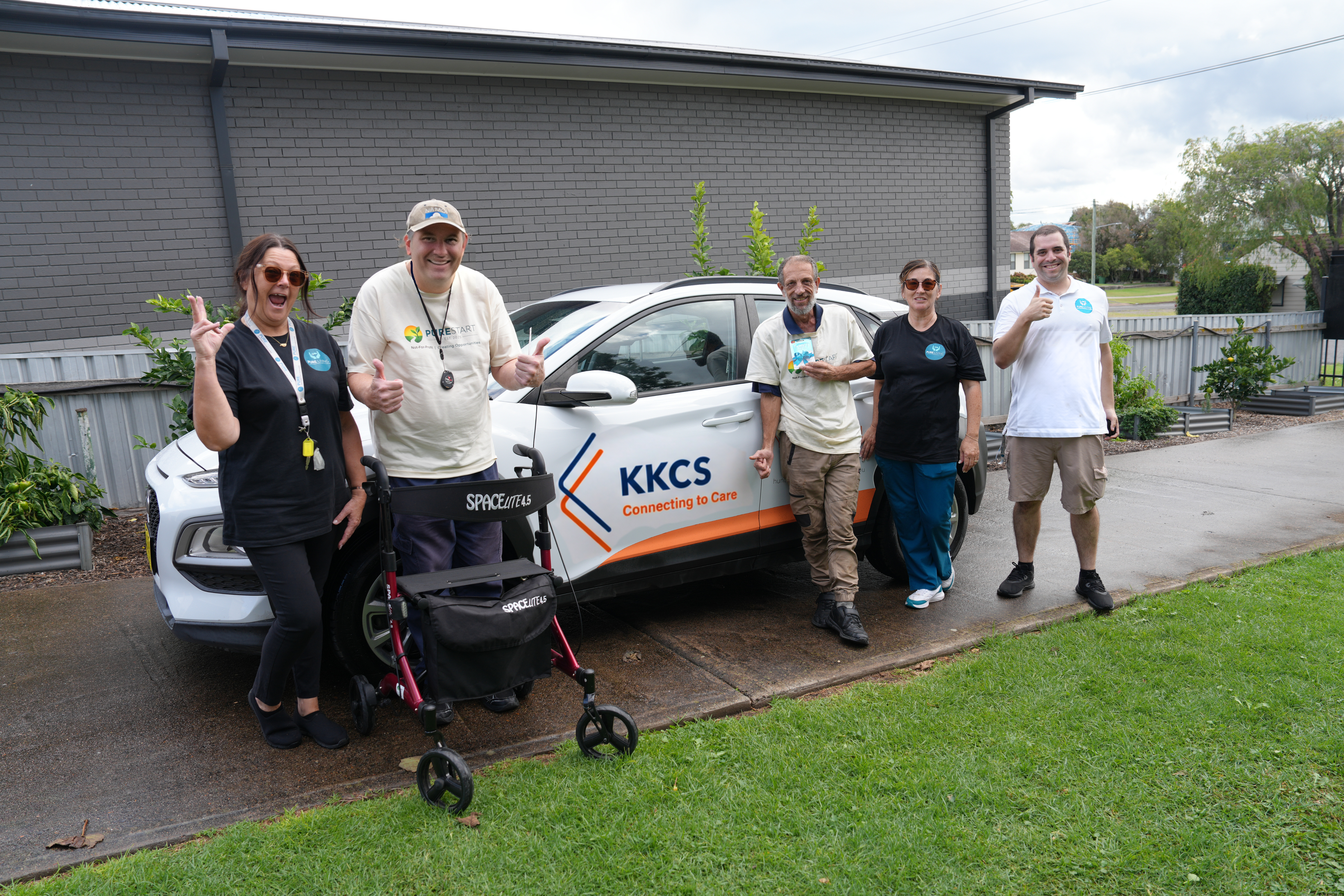 Pure Start and KKCS Connecting to Care team members giving thumbs up