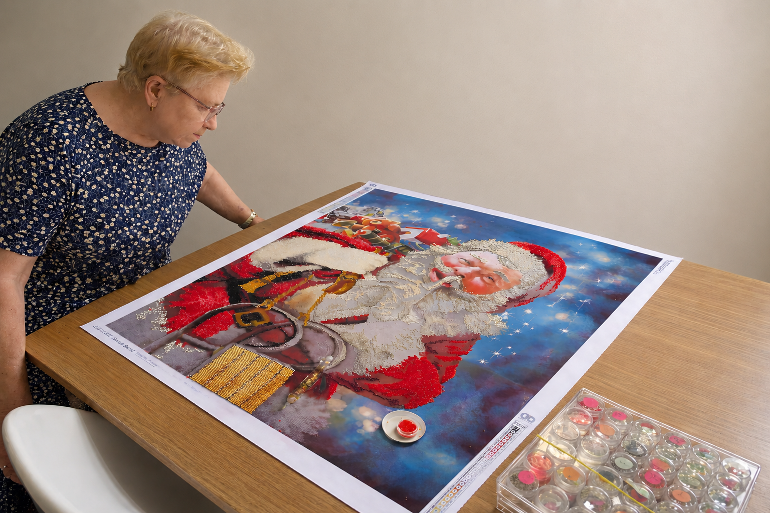 Participant working on a diamond art Santa canvas at the Skills Hub